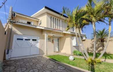 Imagem: A casa possui 5 Dormitórios, 5 Banheiros, 2 Vagas na garagem