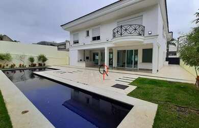 Imagem: A casa em condomínio possui 5 Dormitórios, 5 Banheiros, 5