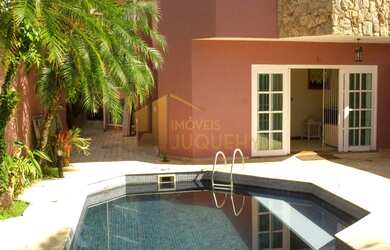 Imagem: A casa possui 5 Dormitórios, 5 Banheiros, 4 Vagas na garagem