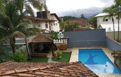 Imagem: A casa possui 3 Dormitórios, 3 Banheiros, 5 Vagas na garagem