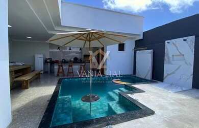 Imagem: A casa possui 4 Dormitórios, 5 Banheiros, 5 Vagas na garagem