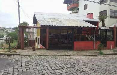 Imagem: A casa possui 3 Dormitórios, 1 Banheiro, 1 Vaga na garagem