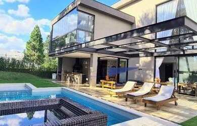 Imagem: A casa em condomínio possui 4 Dormitórios, 5 Banheiros, 5