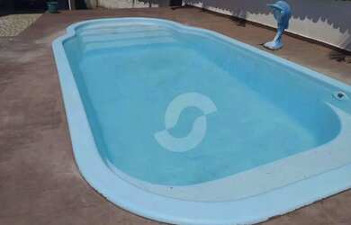 Imagem: A casa possui 3 Dormitórios, 4 Banheiros, 5 Vagas na garagem