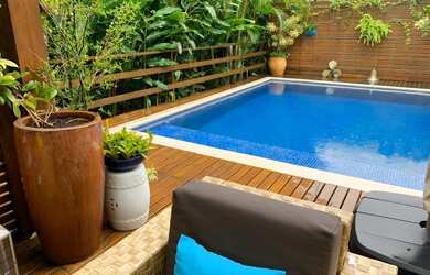 Imagem: A casa possui 4 Dormitórios, 5 Banheiros, 3 Vagas na garagem