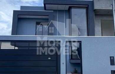 Imagem: A casa possui 3 Dormitórios, 2 Banheiros, 3 Vagas na garagem