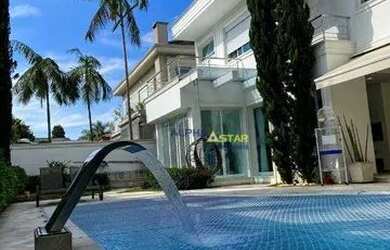 Imagem: A casa em condomínio possui 5 Dormitórios, 5 Banheiros, 5