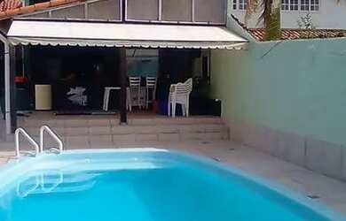 Imagem: A casa possui 5 Dormitórios, 5 Banheiros, 5 Vagas na garagem