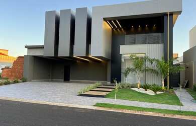 Imagem: A casa possui 3 Dormitórios, 5 Banheiros, 5 Vagas na garagem