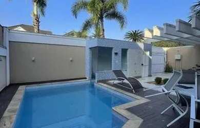 Imagem 2: MARAVILHOSA CASA COM PISCINA PARA VENDA, POSSUI 4 QUARTOS, SENDO 3 SUÍTES E PISCINA