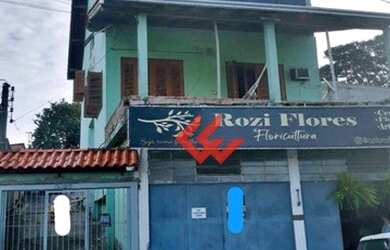 Imagem: A casa possui 4 Dormitórios, 3 Banheiros, 5 Vagas na garagem