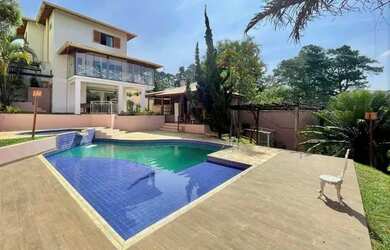 Imagem: A casa possui 3 Dormitórios, 5 Banheiros, 5 Vagas na garagem