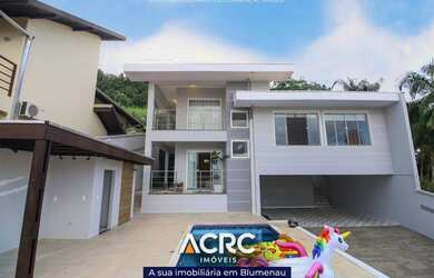 Imagem: A casa possui 4 Dormitórios, 2 Banheiros, 2 Vagas na garagem