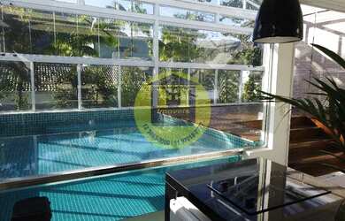 Imagem: A casa em condomínio possui 5 Dormitórios, 5 Banheiros, 2