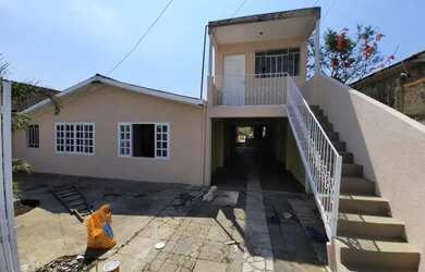 Imagem: A casa possui 3 Dormitórios, 3 Banheiros, 3 Vagas na garagem