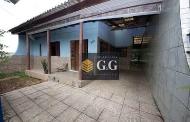 Imagem: A casa possui 4 Dormitórios, 2 Banheiros, 135m² de Área e