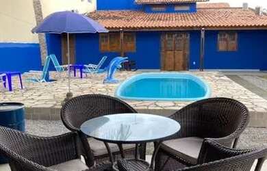 Imagem: A casa possui 3 Dormitórios, 3 Banheiros, 4 Vagas na garagem