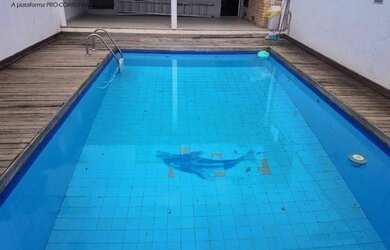 Imagem: A casa possui 4 Dormitórios, 4 Banheiros, 5 Vagas na garagem