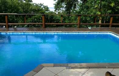 Imagem: A casa possui 4 Dormitórios, 5 Vagas na garagem e está localizado