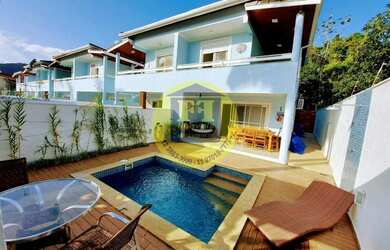 Imagem: A casa possui 4 Dormitórios, 4 Banheiros, 2 Vagas na garagem