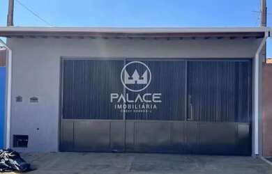 Imagem: A casa possui 3 Dormitórios, 2 Banheiros, 3 Vagas na garagem