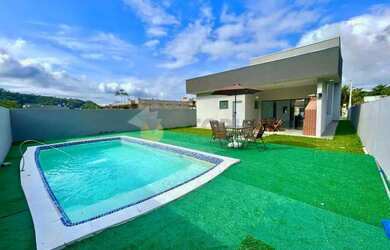 Imagem: A casa possui 3 Dormitórios, 4 Banheiros, 4 Vagas na garagem