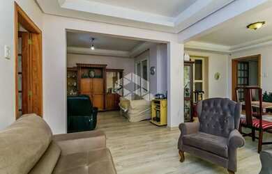 Imagem 4: Apartamento de 113m2, living em 3 ambientes cercado por jardim de inverno