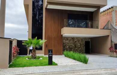 Imagem: A casa em condomínio possui 4 Dormitórios, 5 Banheiros, 4