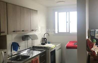 Imagem: O apartamento possui 2 Dormitórios, 1 Banheiro, 1 Vaga na garagem