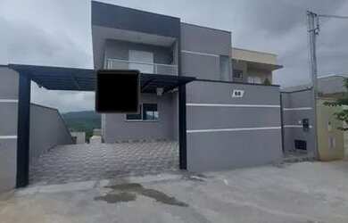 Imagem: A casa possui 3 Dormitórios, 4 Banheiros, 3 Vagas na garagem