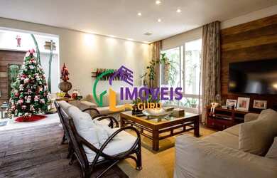 Imagem: A casa possui 3 Dormitórios, 5 Banheiros, 4 Vagas na garagem