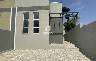 Imagem: A casa possui 3 Dormitórios, 2 Banheiros, 2 Vagas na garagem