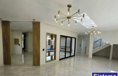 Imagem: A casa em condomínio para alugar possui 4 Dormitórios, 5 Banheiros