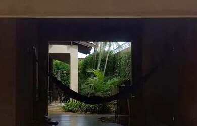 Imagem: A casa possui 3 Dormitórios, 3 Banheiros, 4 Vagas na garagem