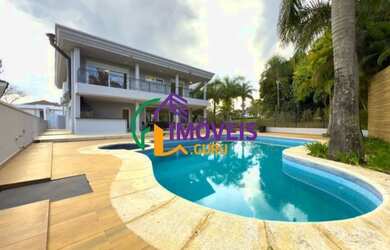 Imagem: A casa em condomínio possui 4 Dormitórios, 5 Banheiros, 5