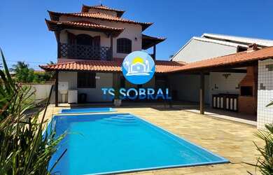 Imagem: A casa possui 5 Dormitórios, 5 Banheiros, 3 Vagas na garagem