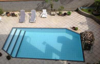 Imagem: A casa possui 4 Dormitórios, 4 Banheiros, 4 Vagas na garagem