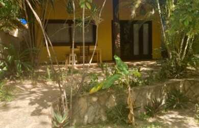 Imagem: A casa possui 2 Dormitórios, 2 Vagas na garagem e está localizado