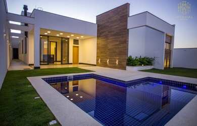 Imagem: A casa possui 3 Dormitórios, 5 Banheiros, 3 Vagas na garagem