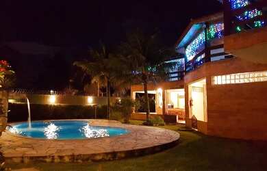 Imagem: A casa possui 5 Dormitórios, 5 Banheiros, 5 Vagas na garagem