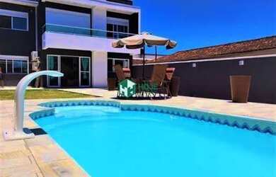 Imagem: A casa possui 4 Dormitórios, 3 Banheiros, 4 Vagas na garagem