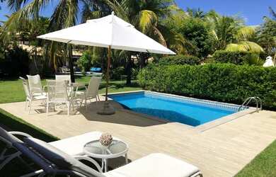 Imagem: A casa possui 4 Dormitórios, 5 Banheiros, 3 Vagas na garagem