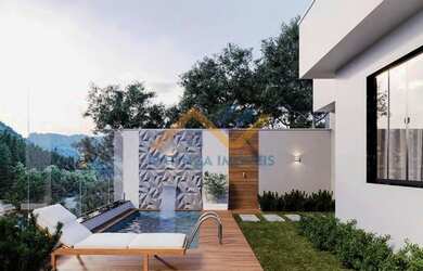 Imagem: A casa possui 3 Dormitórios, 3 Banheiros, 2 Vagas na garagem