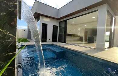 Imagem: A casa em condomínio possui 4 Dormitórios, 5 Banheiros, 4