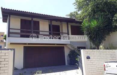 Imagem: A casa possui 3 Dormitórios, 4 Banheiros, 3 Vagas na garagem