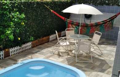 Imagem: A casa possui 3 Dormitórios, 2 Banheiros, 3 Vagas na garagem