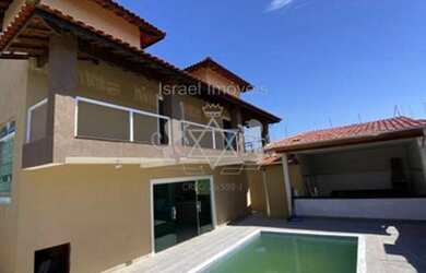 Imagem: A casa possui 3 Dormitórios, 4 Banheiros, 5 Vagas na garagem