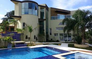 Imagem: A casa em condomínio possui 4 Dormitórios, 5 Banheiros, 5