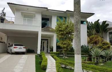 Imagem: A casa em condomínio possui 4 Dormitórios, 5 Banheiros, 2