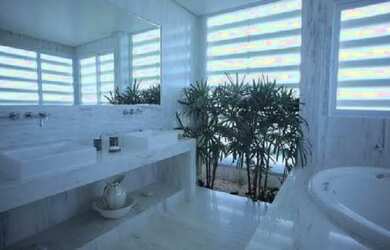 Imagem: A casa possui 3 Dormitórios, 3 Banheiros, 3 Vagas na garagem